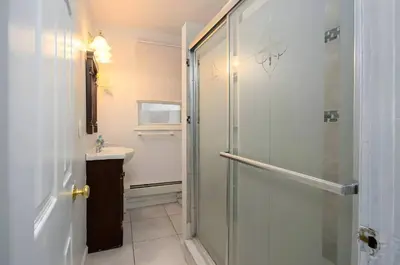 a bathroom with a shower and a sink at Skyline 3BR 20 MIN to T Square #2 in West New York