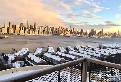 a view of a city with snow covered buildings at Skyline 3BR 20 MIN to T Square #2 in West New York