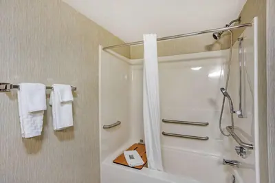 a bathroom with a shower and a white shower curtain at Best Western Danville Inn in Danville