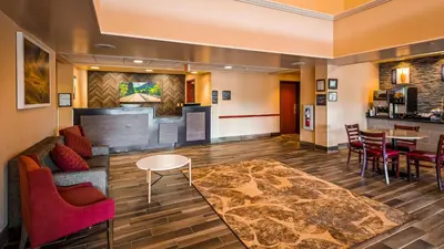 a lobby of a hotel with chairs and a table at Best Western Danville Inn in Danville