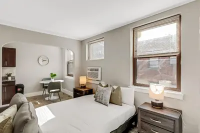 a bedroom with a white bed and a window at Lennox C201 Furnished Studio ATT Students in Philadelphia