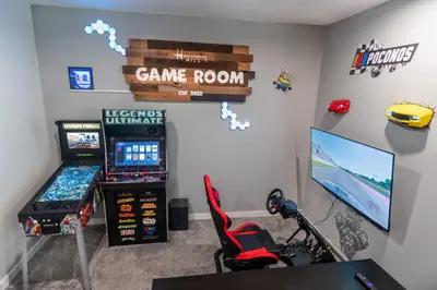 a room with a game room with a video game room at Harmony Hill Stylish 4bd Mountain Retreat, Hot Tub, Games in Bushkill