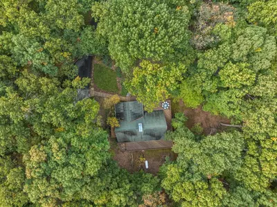 an overhead view of a house in the forest at Star Gazer Luxury A-Frame Wood Cabin. Near York/Harrisburg/Hershey/Lancaster in Goldsboro