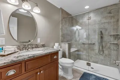 a bathroom with a shower and a toilet and a sink at Star Gazer Luxury A-Frame Wood Cabin. Near York/Harrisburg/Hershey/Lancaster in Goldsboro