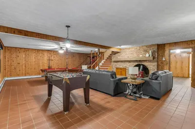 a living room with a ping pong table in it at Star Gazer Luxury A-Frame Wood Cabin. Near York/Harrisburg/Hershey/Lancaster in Goldsboro