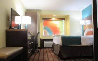 a hotel room with a bed and a desk at Best Western Plus Harrisburg Mechanicsburg in Enola
