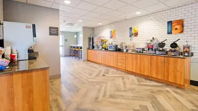 a coffee shop with a counter in a room at Best Western Plus Harrisburg Mechanicsburg in Enola