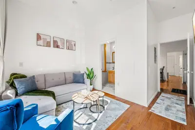 a living room with a couch and a table at Charming Home In Heart of City With King Size Bed! in Philadelphia