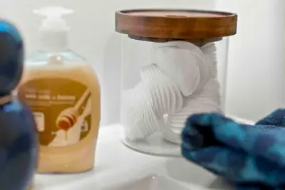 a bottle of soap and a jar of honey at Contemporary Luxury BR, EWR AIRPT, Nyc, Free Pkng, Prudential CNTR, American Dream Mall in Elizabeth