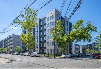 an architectural rendering of an apartment building on a street at Contemporary Luxury BR, EWR AIRPT, Nyc, Free Pkng, Prudential CNTR, American Dream Mall in Elizabeth