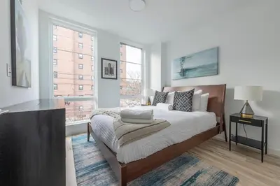 a bedroom with a bed and a window at Modern 3BR Lofts with Outdoor Space Near NYC in Hoboken