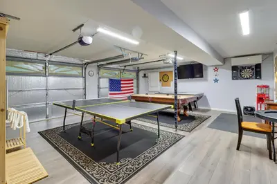 a ping pong room with a ping pong table at Hot Tub, Deck and Game Room Spacious Poconos Escape in Stroudsburg