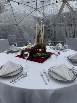 a table with a white table cloth and candles on it at Best Western Plus Clarks Summit Scranton Hotel in Clarks Summit