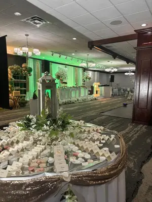a table with flowers on it in a room at Best Western Plus Clarks Summit Scranton Hotel in Clarks Summit