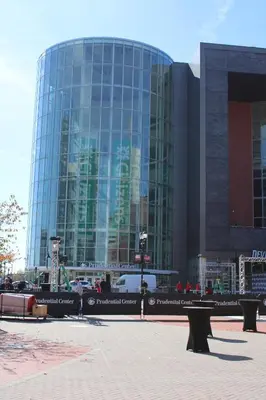 a large glass building with a bench in front of it at Cozy & Deluxe Apartment - EZ Access to NYC in Newark