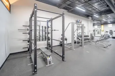 a gym with two tread machines in a room at Cool Urban Stay Dtwn Apt And Patio in Binghamton