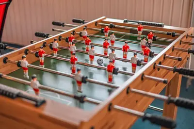 a group of men in red playing a game of pool at Cheerful Chalet - Fireplace, BBQ, Firepit& Hottub in Long Pond