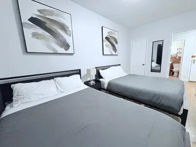 two beds in a room with two beds sidx sidx sidx sidx at Steps from Empire State Building in New York
