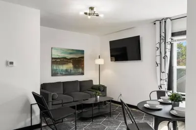 a living room with a couch and a table at Center City Philadelphia 1BR Apartment Sleeps 4, Walk to Attractions in Philadelphia