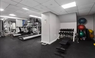 a gym with lots of exercise equipment and balloons at 73-519 New Studio UWS Doorman Gym in New York