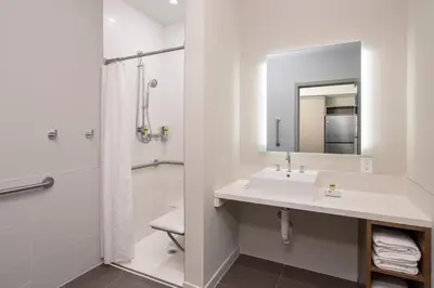 a bathroom with a sink and a shower at Element Harrison-Newark in Harrison