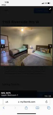 a picture of a bedroom with a bed and a tv at Rosie’s Cabin in Thornhurst