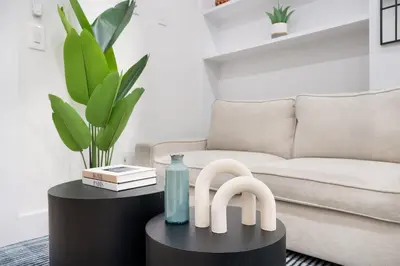 a living room with a couch and a table at 48-4FW Newly renovated W D Midtown in New York