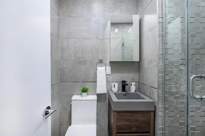 a bathroom with a sink and a toilet and a shower at 48-4FW Newly renovated W D Midtown in New York