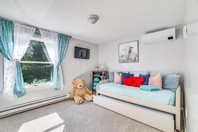 a bedroom with a bed and a teddy bear at 11 Mi to Slopes! Poconos Lake House with Beach in Pocono Summit