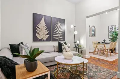 a living room with a couch and a table at 3BR Retreat Walkable to Columbia University in New York