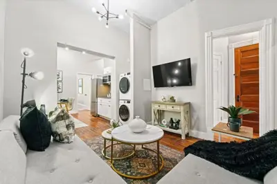 a living room with a couch and a table at 3BR Retreat Walkable to Columbia University in New York
