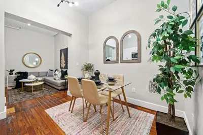 a living room with a table and chairs at 3BR Retreat Walkable to Columbia University in New York