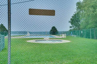 a fence with a circle in the middle of a park at Mango Mountain House Pocono in Albrightsville