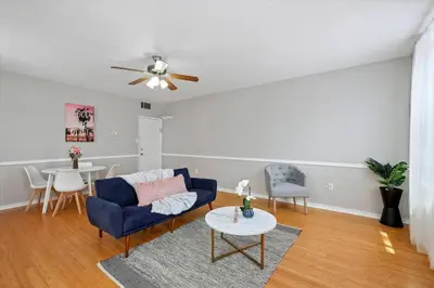 a living room with a blue couch and a table at Cozy 1BR w Deck Near Rittenhouse in Philadelphia