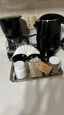 a tray on a kitchen counter with a coffee pot and other items at Cozy 1BR w Deck Near Rittenhouse in Philadelphia