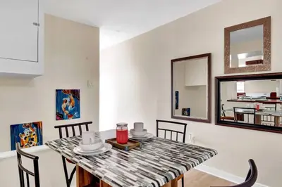 a dining room with a table and chairs at Stylish 1BR Prime Location in Philadelphia