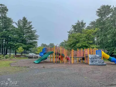 a park with a playground with a slide at Cozy, Spacious House *New*InTheCommunity+Fire Pit in Tobyhanna