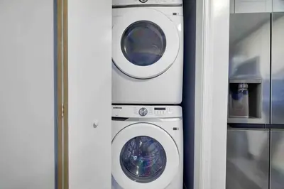 a washing machine and a dryer in a room at Cozy, Spacious House *New*InTheCommunity+Fire Pit in Tobyhanna