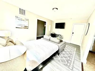 a bedroom with a large bed and a couch at Lennox B401 Peaceful & Perfect Studio Apt in Philadelphia