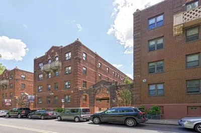 a brick building with cars parked in front of it at Lennox B401 Peaceful & Perfect Studio Apt in Philadelphia