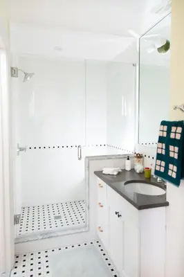 a white bathroom with a sink and a shower at The Suites at the Touraine No 109 in Philadelphia