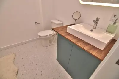 a bathroom with a white toilet and a sink at Wonder Loft A3 - Main St. Honesdale in Honesdale