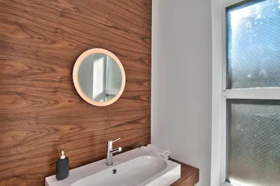 a bathroom with a sink and a mirror at Wonder Loft A3 - Main St. Honesdale in Honesdale