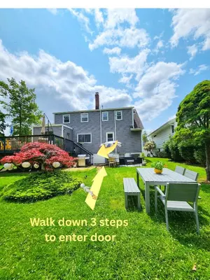 a house with a yard with a table and a playground at Starlight Guesthouse in West Orange