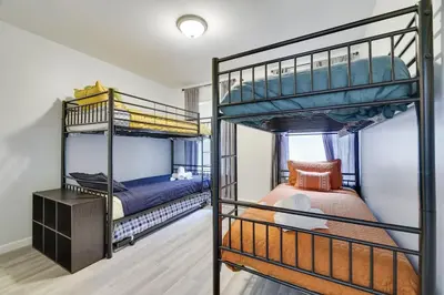 a bedroom with two bunk beds in a room at Nature’s Haven:4 br/2.5 bath, game room & Fire pit in Tobyhanna