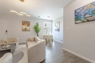 a living room with a couch and a table at Modern one bedroom apartment in Elizabeth