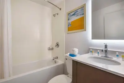 a bathroom with a sink and a toilet and a bath tub at Comfort Inn Philadelphia International Airport West in Chester