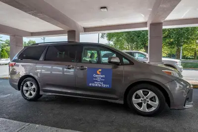 a small silver car parked in a parking lot at Comfort Inn Philadelphia International Airport West in Chester