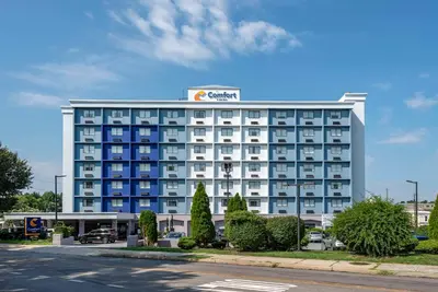 a hotel building with a sign on top of it at Comfort Inn Philadelphia International Airport West in Chester
