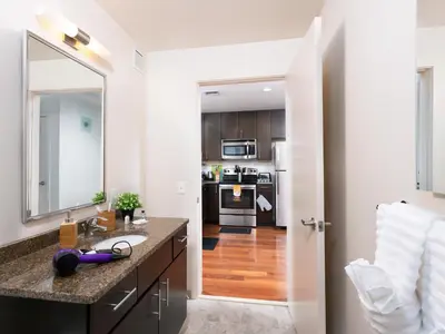 a kitchen with a sink and a mirror at Pet Friendly 2 Bedroom and 2 Bathroom Apartment near Rittenhouse apts in Philadelphia
